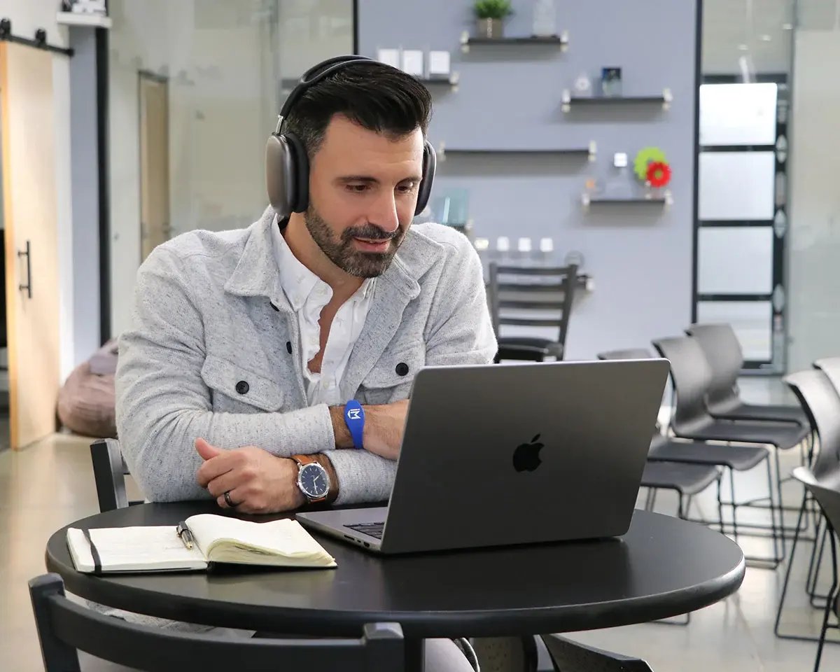 14-man-working-on-laptop-with-headphones