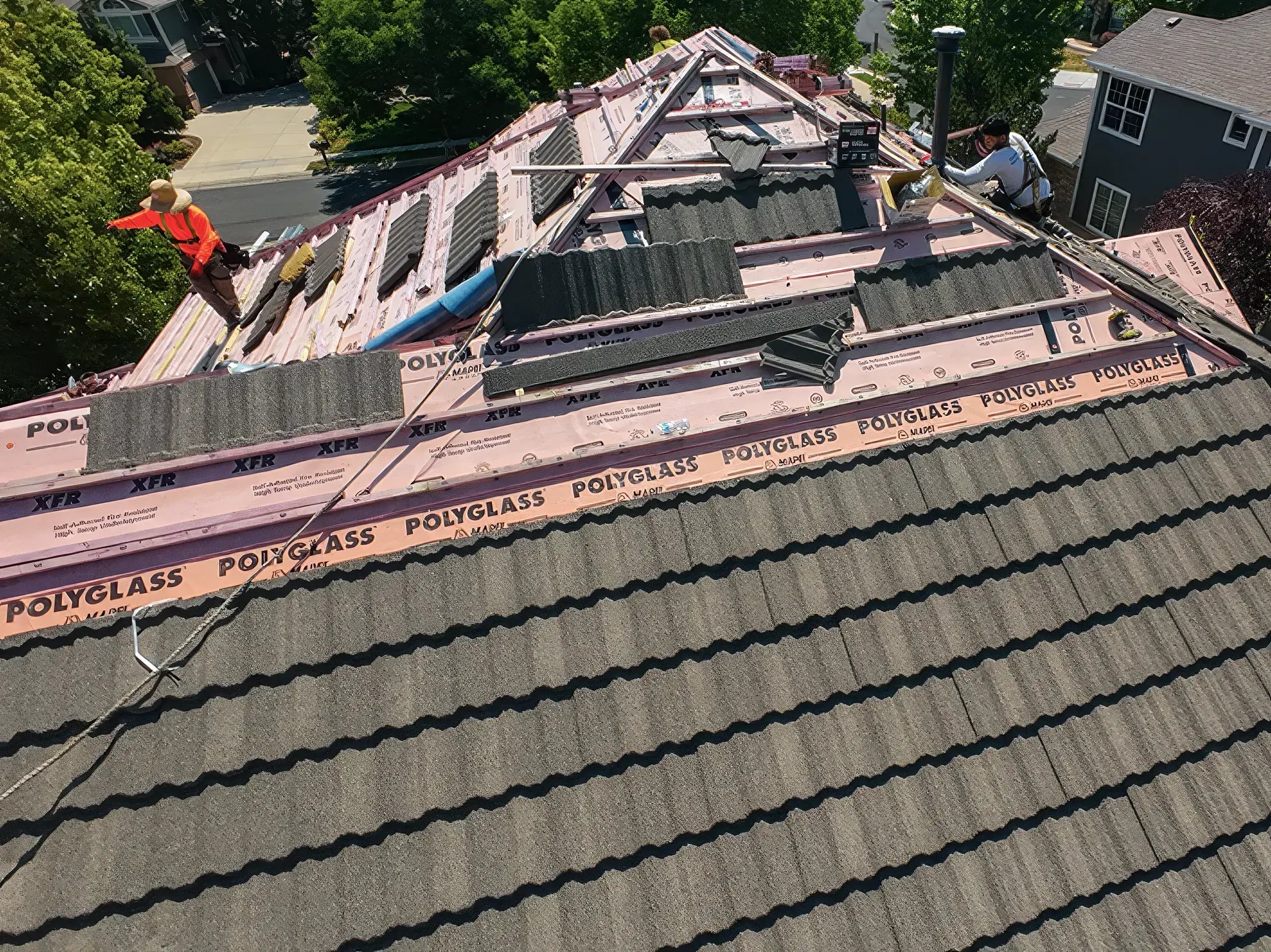 A beautiful home with stone-coated steel panels being installed by Excel Roofing contractors