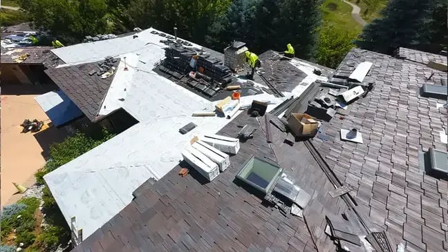 Cherry Hills home in Colorado with a Brava synthetic cedar shake roof being installed with hi temp ice and water shield