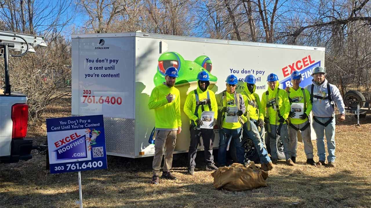 Excel Roofing Contractor Crew in front of the Infamous Excel Roofing Trailer