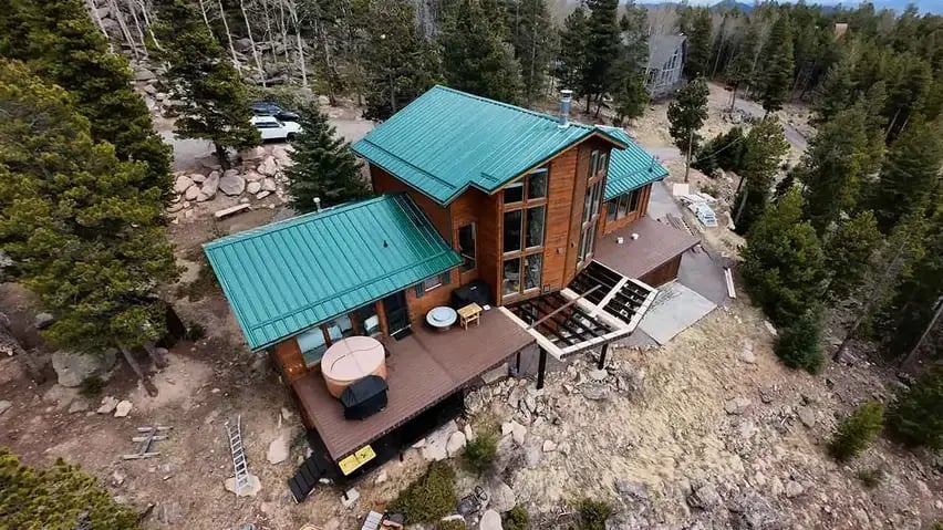 Green PBR roof on a conifer CO mountain home