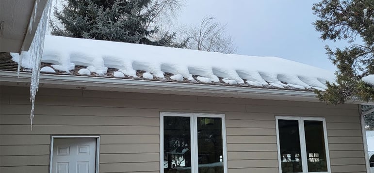 ice dam on home roofing