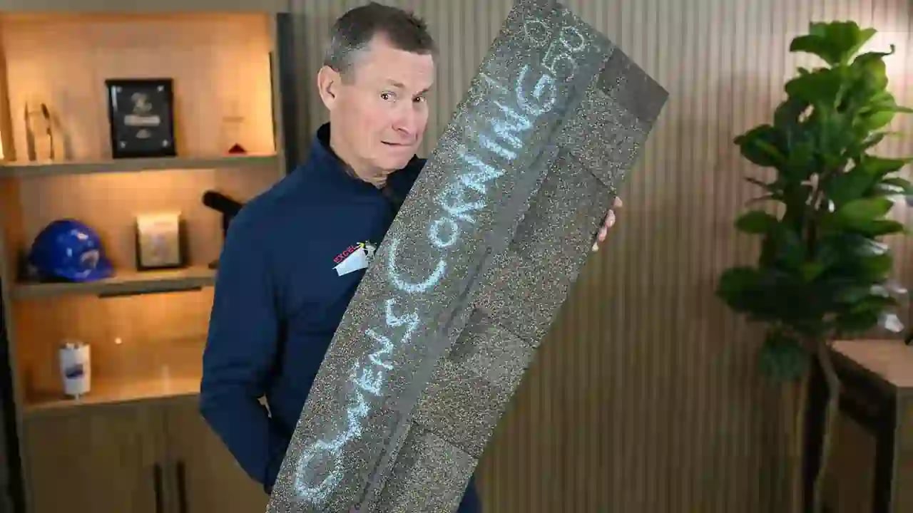 J Bretz holding an Owens Corning class 4 shingle in the Excel Roofing studio