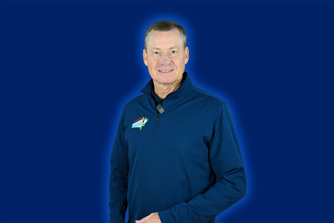 Expert roofer J Bretz, founder of Excel roofing in a dark blue pullover