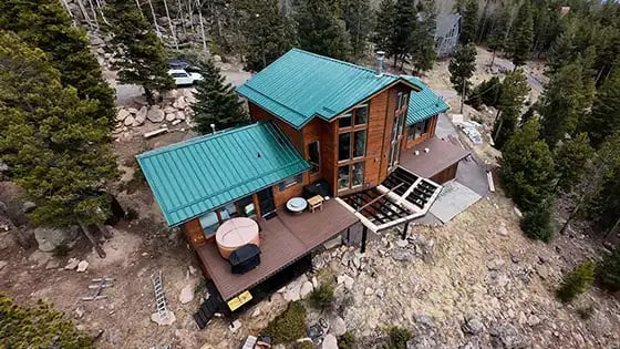 green metal roof on a beautiful colorado mountain home