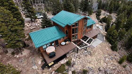 green metal roof on a colorado mountain home