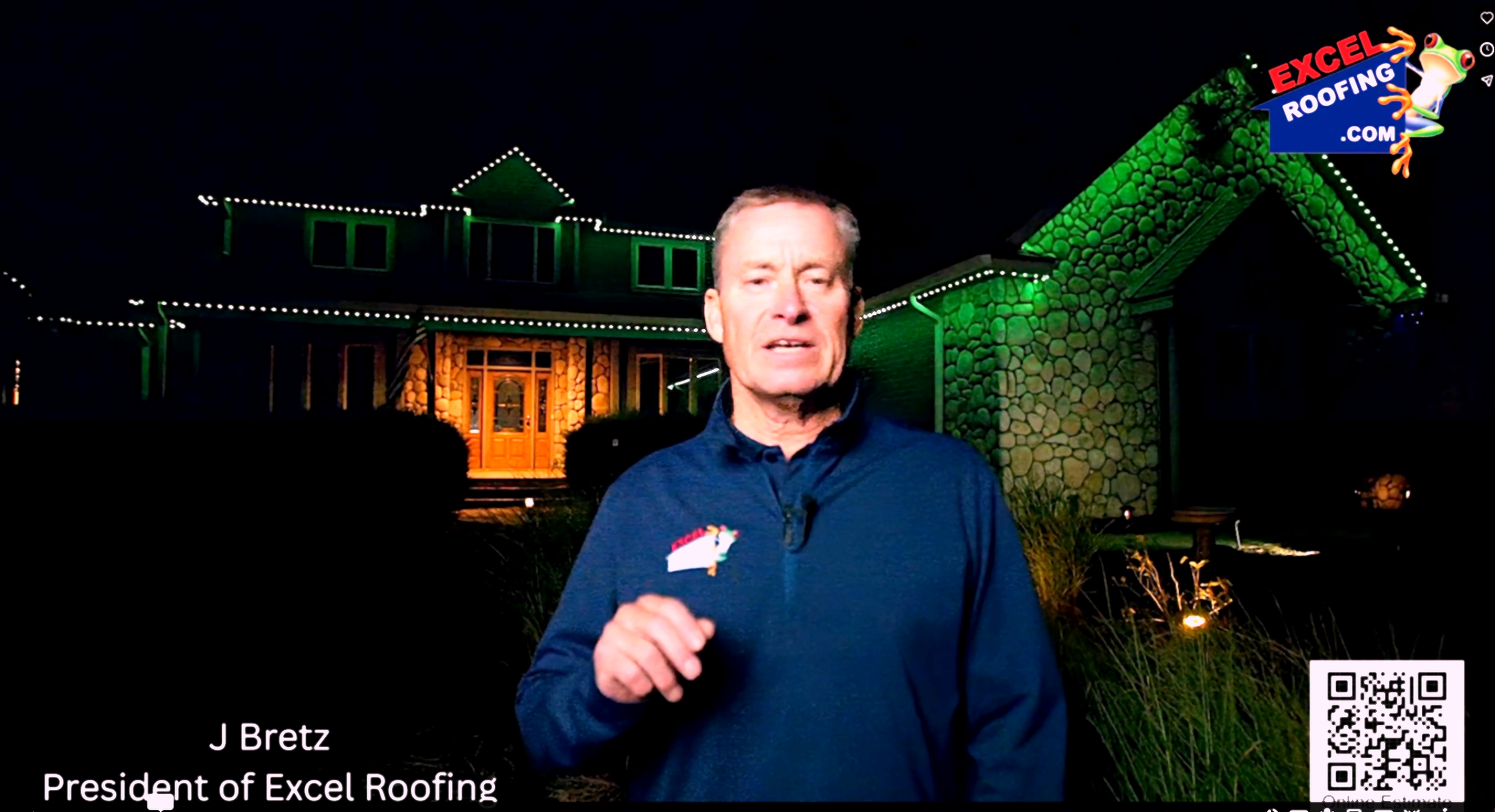 Holiday lights installed along residential roofline and eaves at night