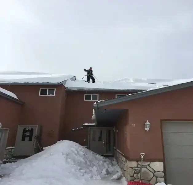 man on top of roof