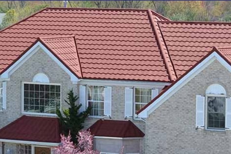 Red stone coated steel roof installed on residential home