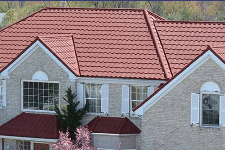 Red stone coated steel roof installed on residential home