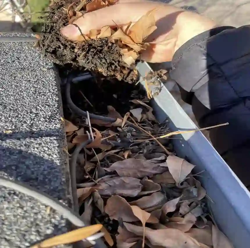 unclogging gutters