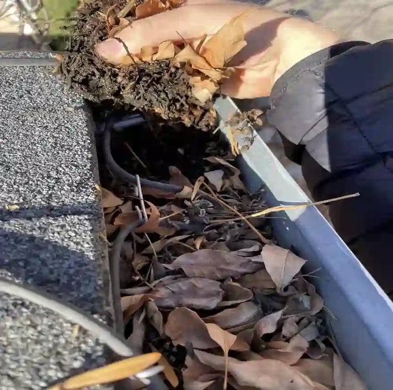 unclogging gutters