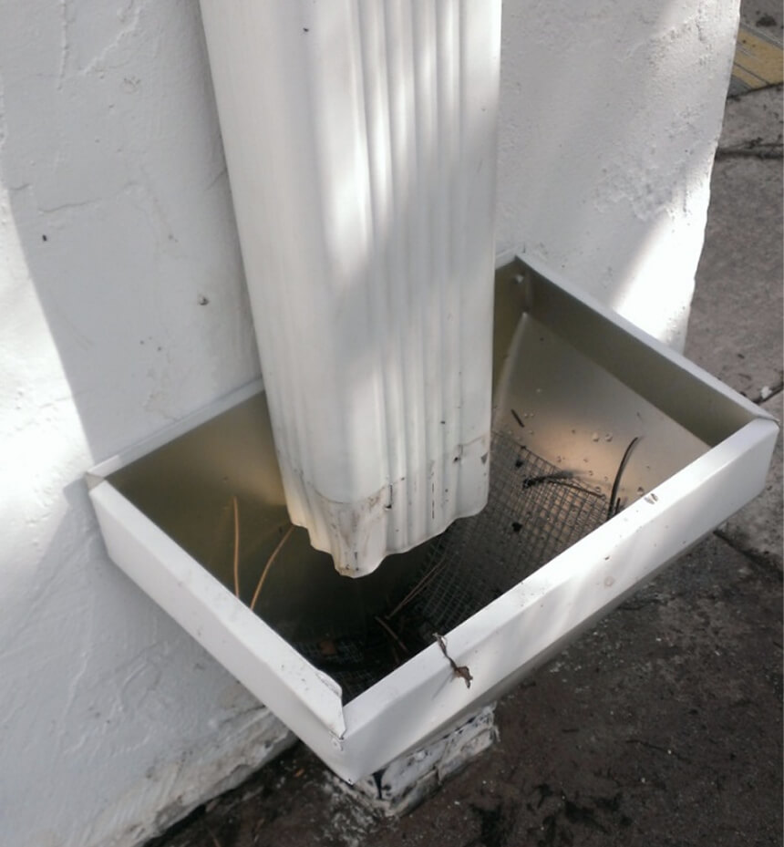 Excel Roofing's Downspout Cleanout System