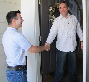 Man shaking hands with an Excel Roofing contractor