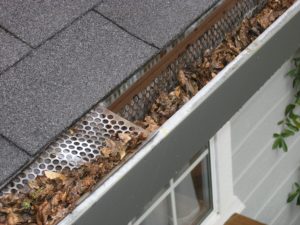 clogged gutters with gutter cover
