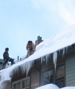 removing-ice-dam-from-roof-winter-snow